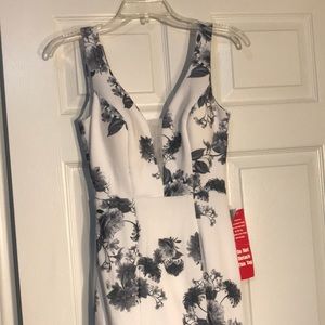 White dress with gray floral design. Stretchy material. Low back, front has mesh